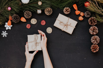 Christmas background new year gifts hands toys balls fruits nuts