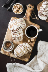 White meringue drizzled with chocolate. Italian dessert	