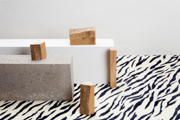 concrete blocks, raw wood and zebra carpet.