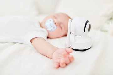 Baby is being monitored with baby monitor while sleeping