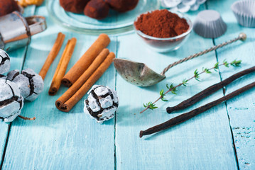 Christmas chocolate truffles and spices on shabby chic blue wood table