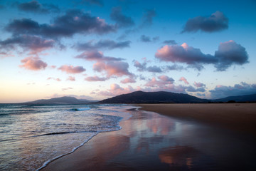 Sunset with red clouds at Los Lances beach, Tarifa, Cadiz province, Andalusia, Spain