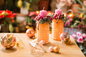 Hand made Christmas candle ring at florist's workshop table