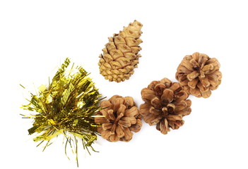 Golden tinsel, Christmas and New Year's ornament, decoration with pine cones isolated on white background, top view