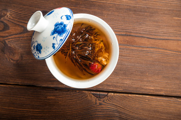 Ceylon tea in a teapot and mug closeup. Leafy beautiful tea copy space. Autumn, comfort, tea, warmth, concept.