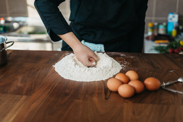 Chef making fresh pasta in the kitchen