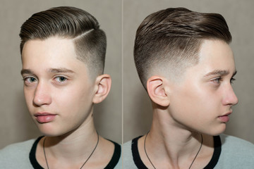Stylish modern retro haircut side part with mid fade with parting of a school boy guy in a...