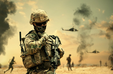 Military forces & helicopters between smoke and dust at battlefield.