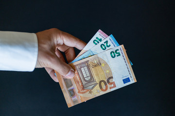 Man holds in hands euro cash money. Isolated European currency.