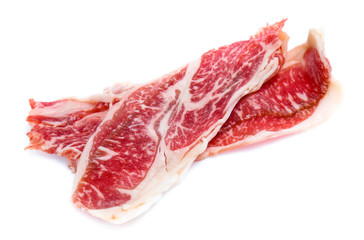 Fresh raw beef meat slices isolated over white background