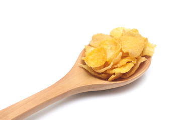 Cornflakes on spoon wood isolated on white background