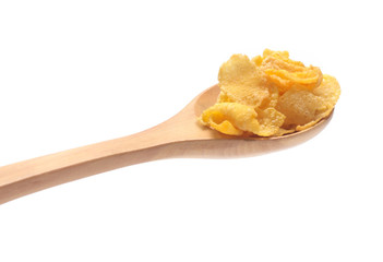 Cornflakes on spoon wood isolated on white background