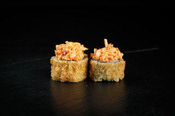 pair of rolls tokyo close-up on a dark background