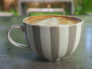 Hot Latte Coffee on table concrete Scrub