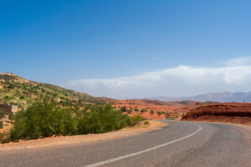 Fototapeta na wymiar High atlas mountains in Morocco, North Africa. Empty asphalt road, beautiful landscape, sunny day 
