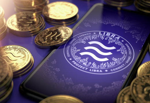 Libra concept coin design on-screen and laying golden Libra concept coins. Libra cryptocurrency in everyday use concept. 3D rendering