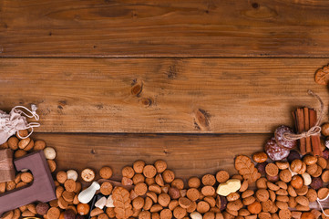 A traditional Dutch holiday for children of Sinterklaas. Winter holidays in Europe and the Netherlands. background with pepernoten and traditional sweets. A form for writing text. Background.