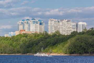 Ship on the Volga in the background of residential buildings in Samara, Russia