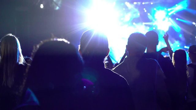Concept view of crowd of the people in fan zone on concert in front of the stage live fest rave party festival event agency