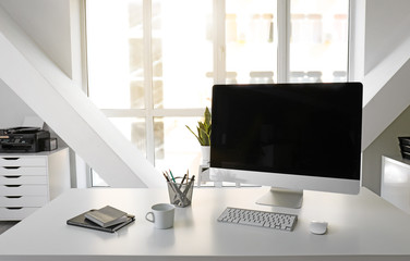 Comfortable workplace in light modern office
