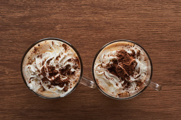 top view of Christmas cacao with whipped cream on wooden table