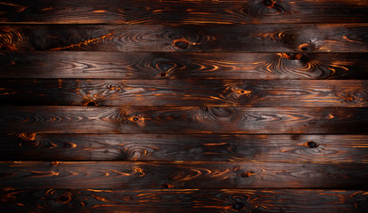 Burnt wooden board, black charcoal wood texture, burned barbecue background - obrazy, fototapety, plakaty