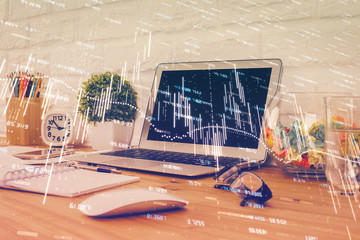 Financial graph colorful drawing and table with computer on background. Double exposure. Concept of international markets.