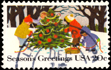 A stamp printed in UNITED STATES OF AMERICA shows Kids Making A Snowman with inscription "Seasons Greetings", Christmas Issue
