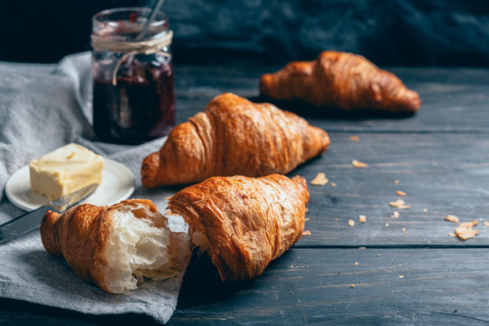 delicious croissants on wooden table
