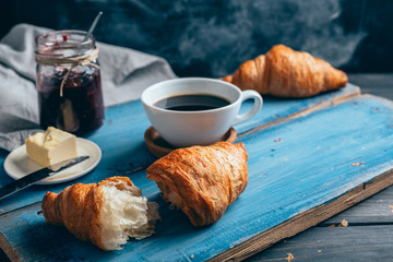 delicious croissants on wooden table