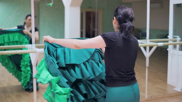 the girl dances flamenco, bata