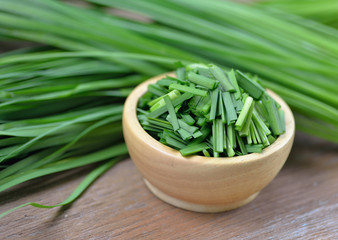 beautiful green onion chives on background.