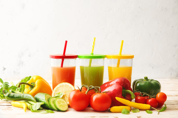 Glasses of fresh juice on table