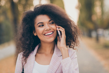 Closeup photo of amazing pretty dark skin lady spending time walk park after university lectures...