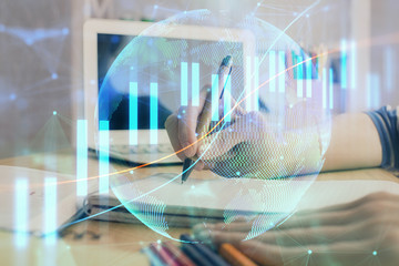 Financial forex charts displayed on woman's hand taking notes background. Concept of research. Double exposure