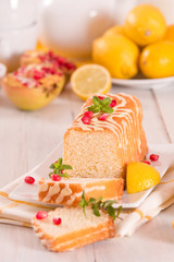 Lemon sponge cake with pomegranate.