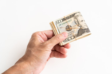 Hand holding American dollars banknote on white background