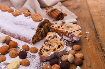 Traditional German Christmas pastries, miscellaneous cookies and chocolate for the holiday. Christmas stollen