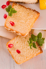 Lemon sponge cake with pomegranate.