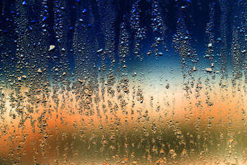 Fototapeta na wymiar Drops on glass as a background