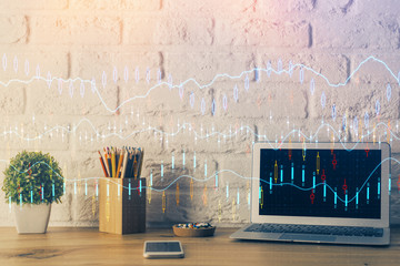 Double exposure of chart and financial info and work space with computer background. Concept of...