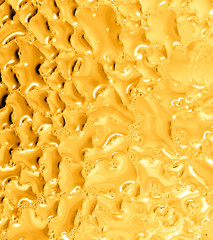 Drops of water on a gold background
