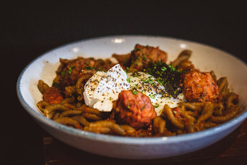 pasta with Smoked Duck, Rosemary Meatballs, Beef Bacon Bits, Black Truffle Pate, Salt Cured Egg Yolk, Truffle Oil, Roasted Red Pepper Sauce.