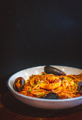 Seafood Slam pasta with Pomodoro, pasta, prawns, mussels, calamari in a bowl