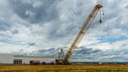 Fototapeta na wymiar Giant crane on a construction site