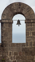 Mission bell in brick arch 
