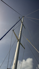 Boat mast against blue sky