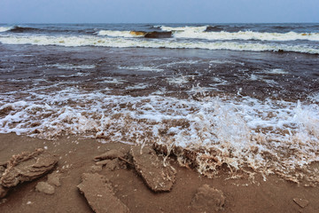 waves and splashes of cold water of a winter lake