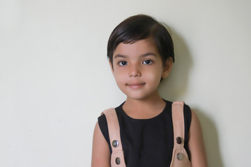 Cute indian girl child wearing spectacles and showing expression 