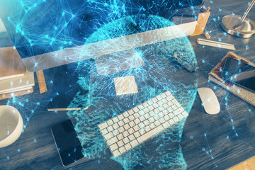 Double exposure of table with computer and brain hologram. Data innovation concept.